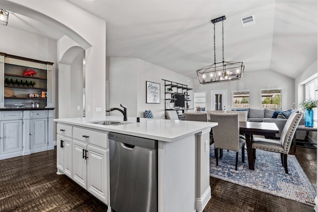 kitchen with white cabinetry, sink, hanging light fixtures, a kitchen island with sink, and stainless steel dishwasher