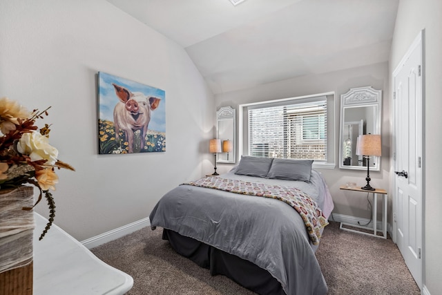 carpeted bedroom with vaulted ceiling