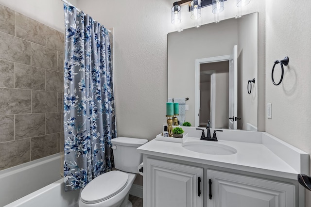 full bathroom with vanity, shower / tub combo, and toilet