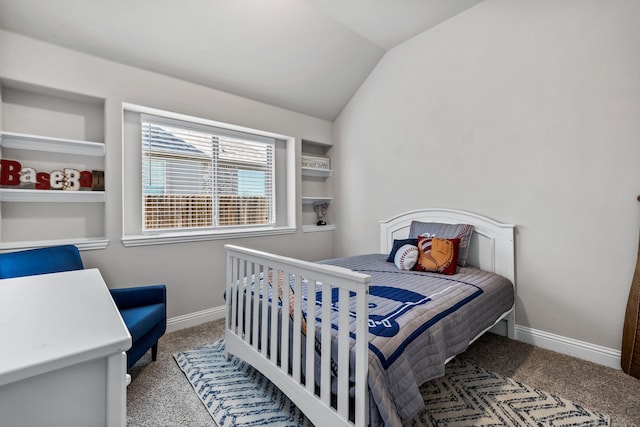 carpeted bedroom with lofted ceiling