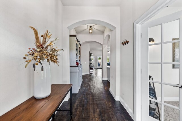 hallway featuring dark hardwood / wood-style flooring