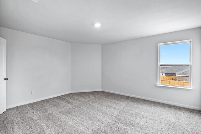 unfurnished room featuring carpet flooring