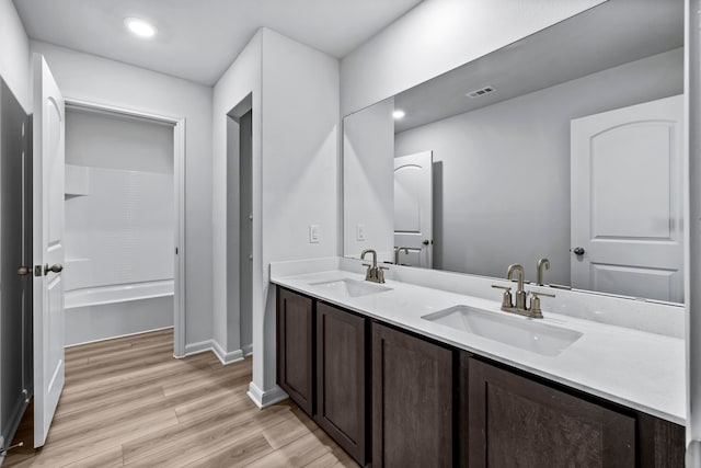 bathroom featuring vanity and wood-type flooring