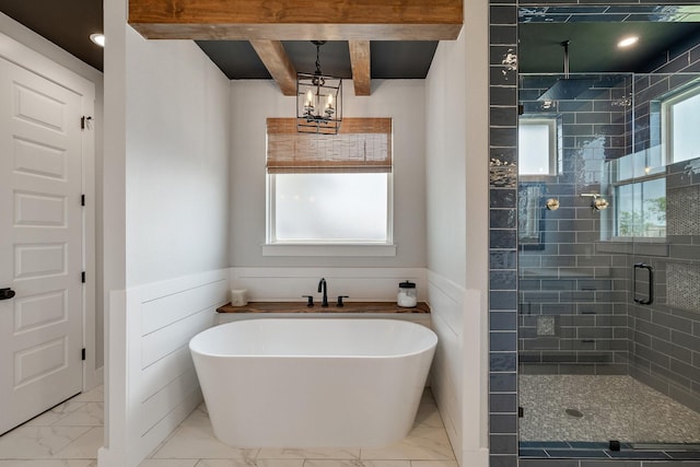 bathroom with beamed ceiling, a notable chandelier, and shower with separate bathtub