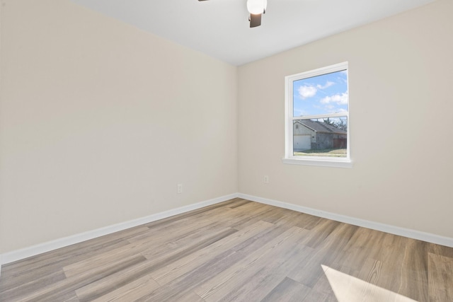 empty room with light hardwood / wood-style floors and ceiling fan