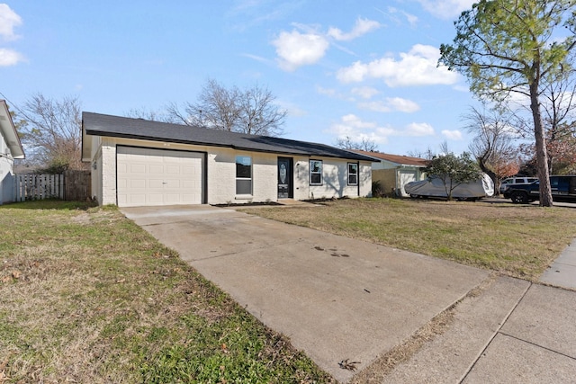 ranch-style house featuring a garage and a front yard