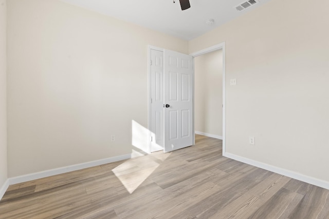 unfurnished room with ceiling fan and light hardwood / wood-style floors