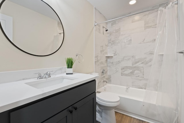 full bathroom with wood-type flooring, toilet, vanity, and shower / bathtub combination with curtain