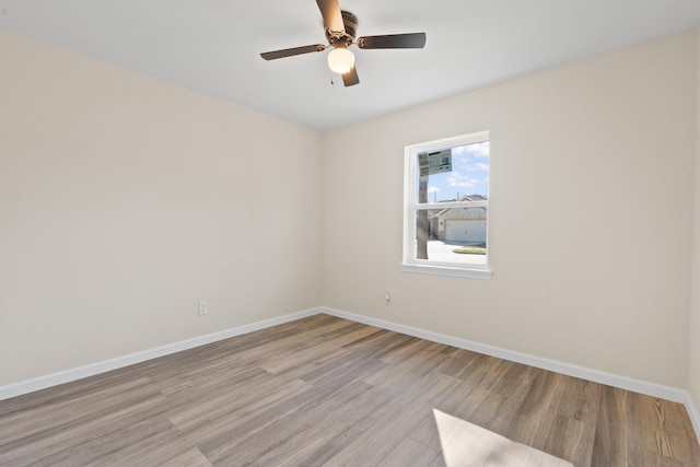 unfurnished room featuring ceiling fan and light hardwood / wood-style floors