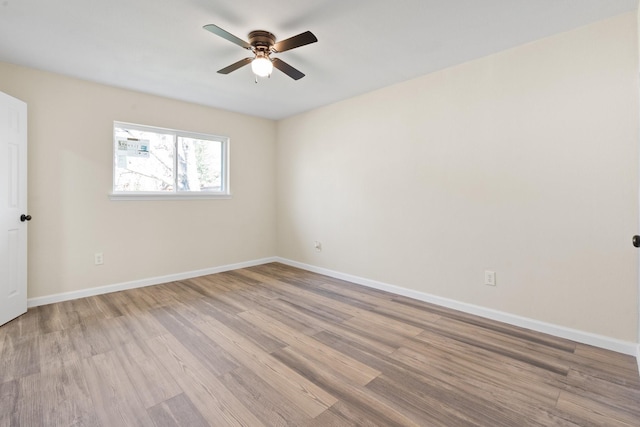 spare room featuring ceiling fan and light hardwood / wood-style floors