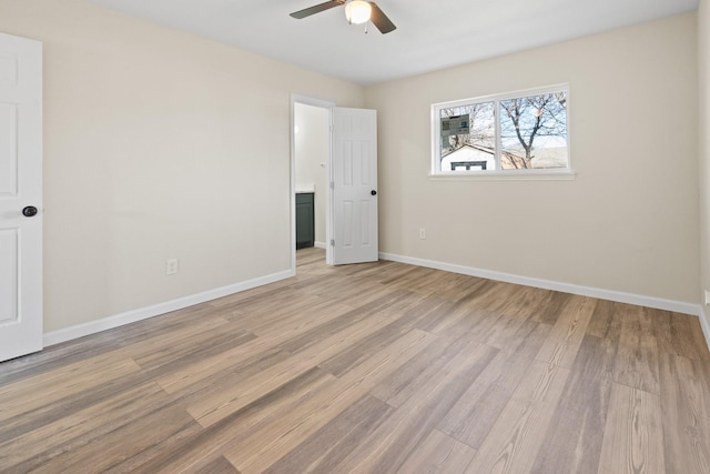 unfurnished room with ceiling fan and light hardwood / wood-style floors