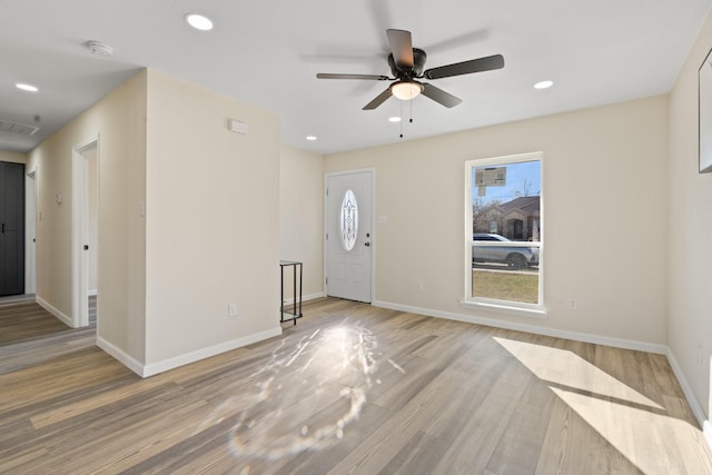 foyer featuring ceiling fan and light hardwood / wood-style floors