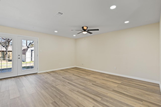 unfurnished room featuring light wood-type flooring, ceiling fan, and french doors