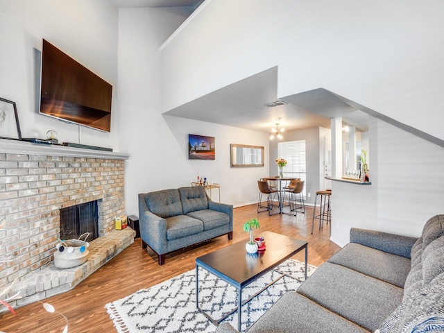 living room with a fireplace and light hardwood / wood-style floors