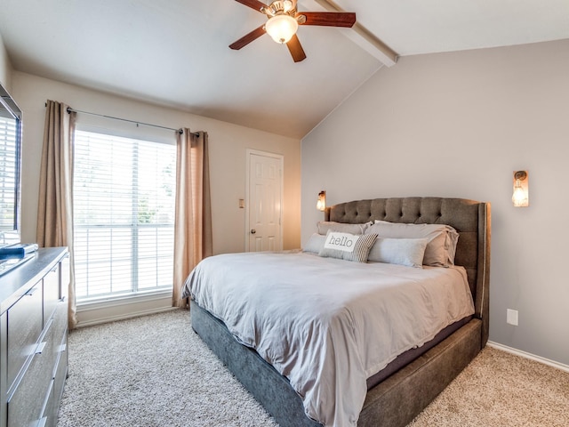 bedroom featuring vaulted ceiling with beams, ceiling fan, and light carpet