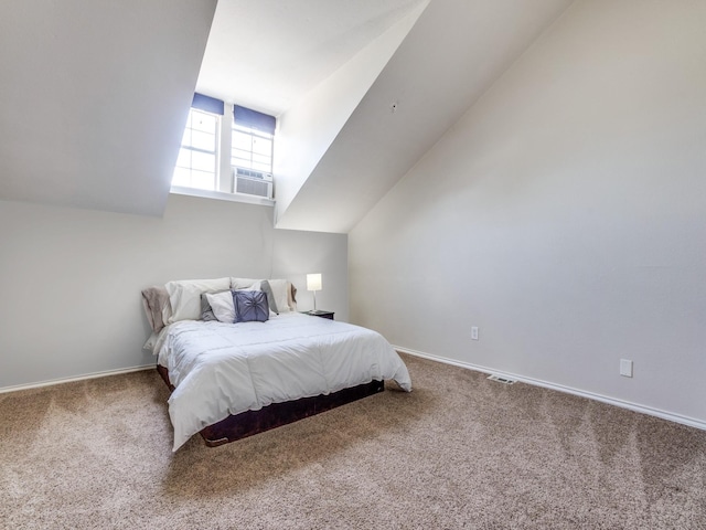 carpeted bedroom featuring cooling unit and lofted ceiling