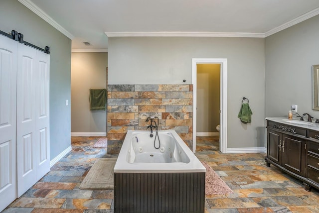 bathroom featuring vanity, toilet, ornamental molding, and a washtub