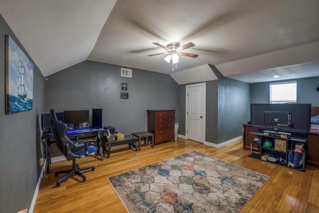 office space featuring wood-type flooring, vaulted ceiling, and ceiling fan