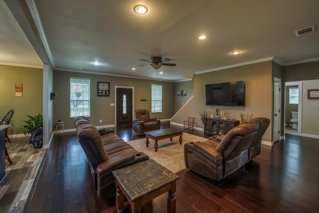 living room with ceiling fan, crown molding, and dark wood-type flooring