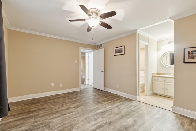 unfurnished bedroom featuring connected bathroom, ceiling fan, sink, crown molding, and light wood-type flooring