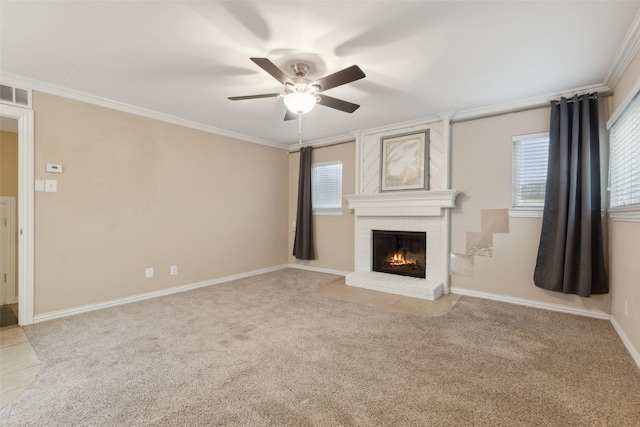 unfurnished living room featuring ceiling fan, light colored carpet, crown molding, and a brick fireplace