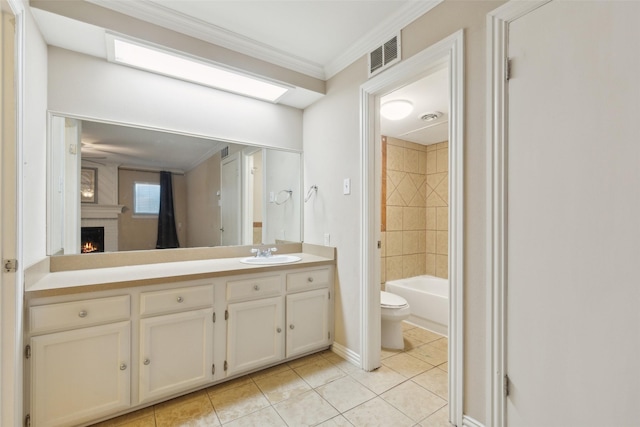 full bathroom with tile patterned floors, vanity, crown molding, a fireplace, and toilet