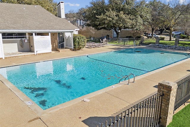 view of swimming pool featuring a patio area