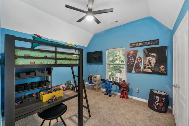 carpeted bedroom with ceiling fan and vaulted ceiling