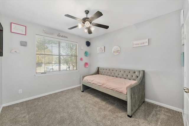 bedroom featuring ceiling fan and light carpet