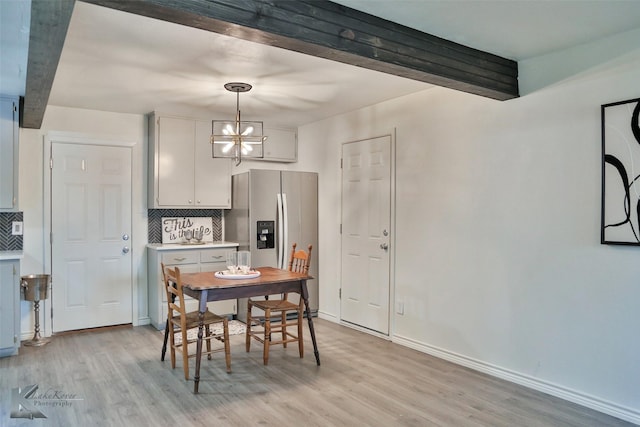 dining space with light hardwood / wood-style floors