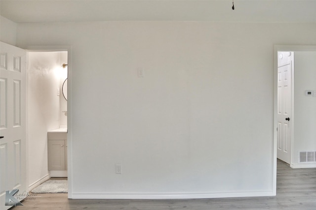 unfurnished room featuring light wood-type flooring