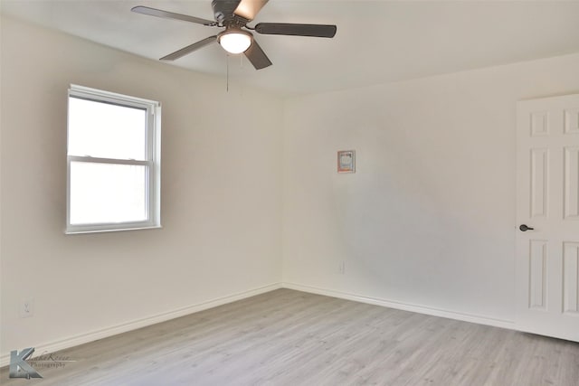 spare room featuring ceiling fan and light hardwood / wood-style floors