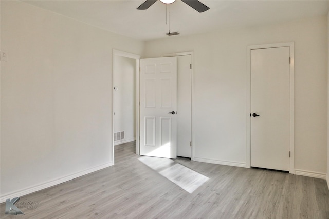 unfurnished bedroom with ceiling fan and light hardwood / wood-style flooring