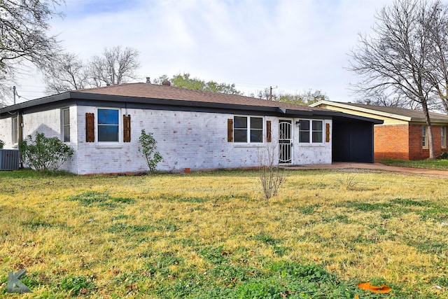 ranch-style home with a front yard and central air condition unit