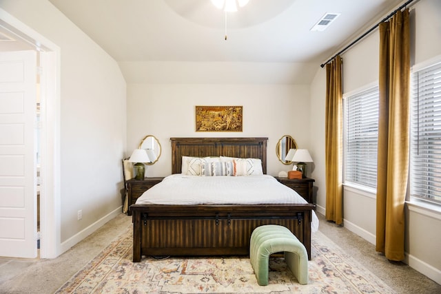 bedroom with ceiling fan, light colored carpet, and lofted ceiling