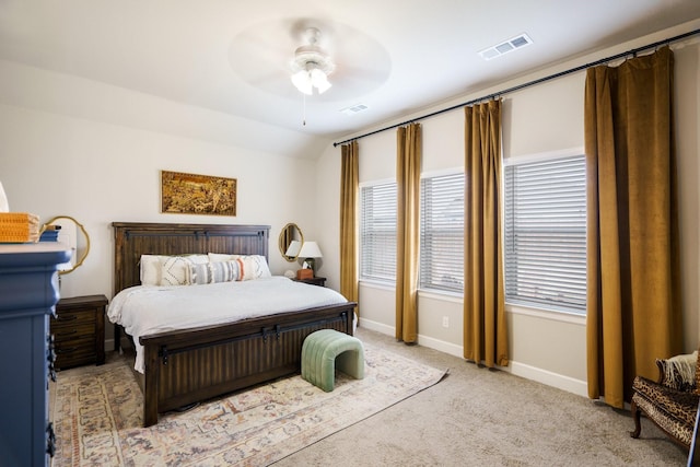 bedroom featuring ceiling fan, light colored carpet, and vaulted ceiling