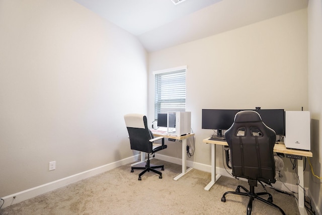 office area featuring carpet flooring and lofted ceiling