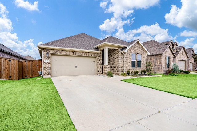 view of front of house with a garage and a front yard