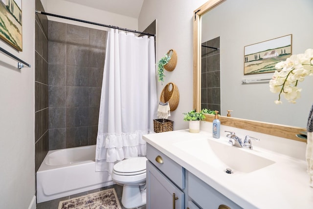 full bathroom featuring tile patterned floors, vanity, shower / bathtub combination with curtain, and toilet