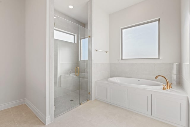 bathroom with tile patterned flooring and plus walk in shower