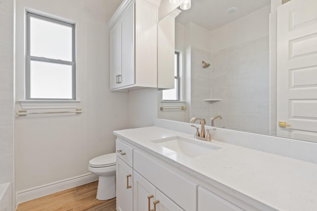 412 Collum, Azle, TX 76020 - full bathroom with tiled shower, vanity, baseboards, and toilet