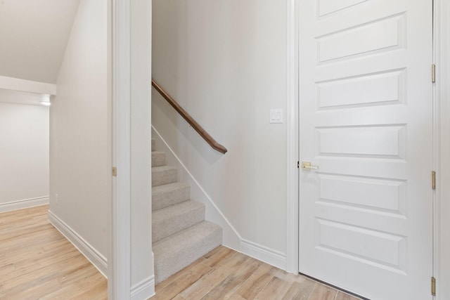 stairway featuring hardwood / wood-style floors