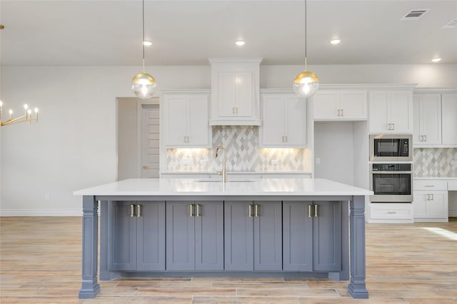 412 Collum, Azle, TX 76020 - kitchen featuring oven, a sink, white cabinetry, light countertops, and recessed lighting