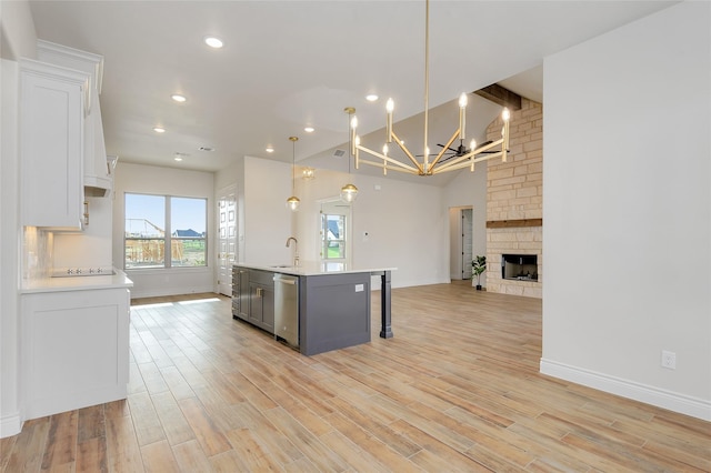 412 Collum, Azle, TX 76020 - kitchen with open floor plan, dishwasher, a sink, light countertops, and a chandelier