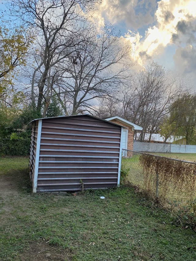 outdoor structure at dusk with a lawn