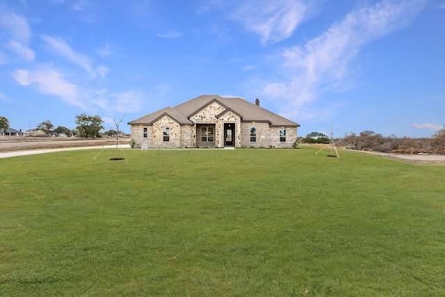 105 Bosal Ln, Weatherford, TX 76088 - french country home with a front lawn, stone siding, a chimney, and a shingled roof