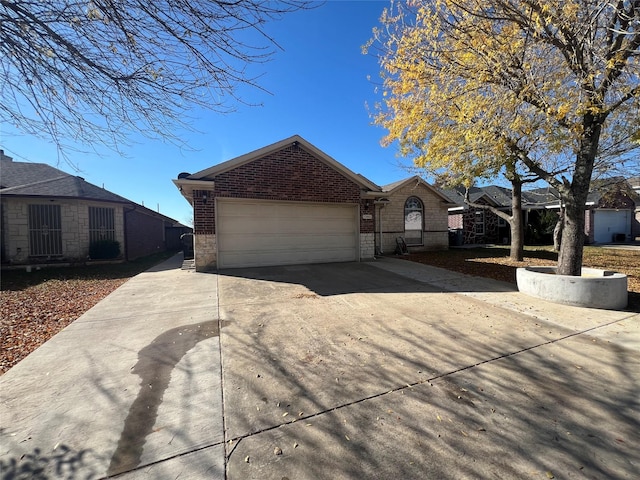 ranch-style house featuring a garage