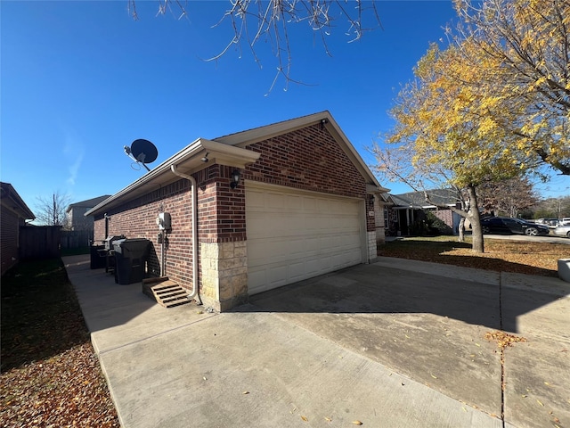 view of side of home featuring a garage