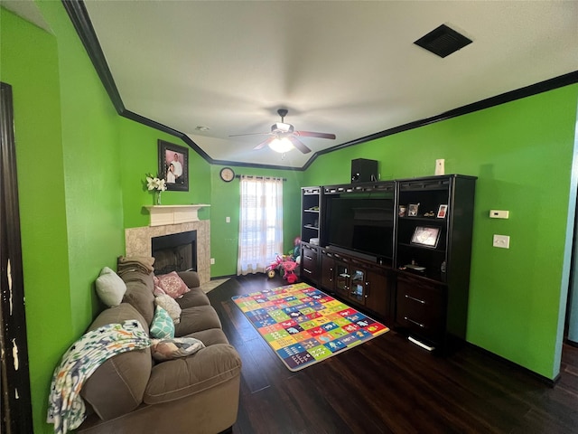 living room with dark hardwood / wood-style floors, ceiling fan, and ornamental molding