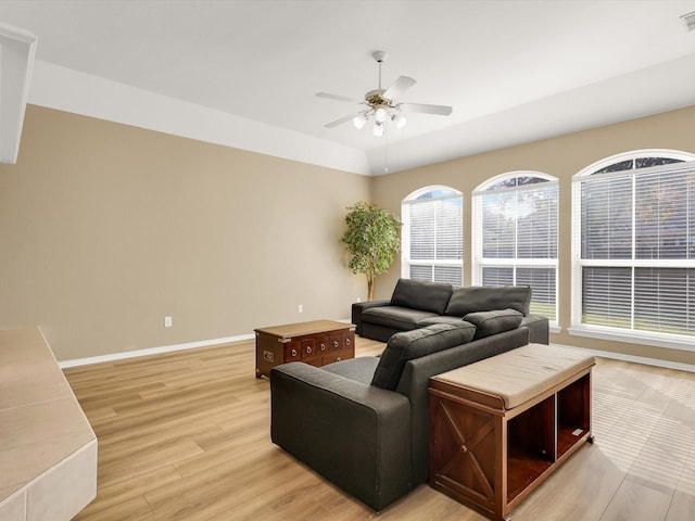 living room featuring ceiling fan and light hardwood / wood-style flooring